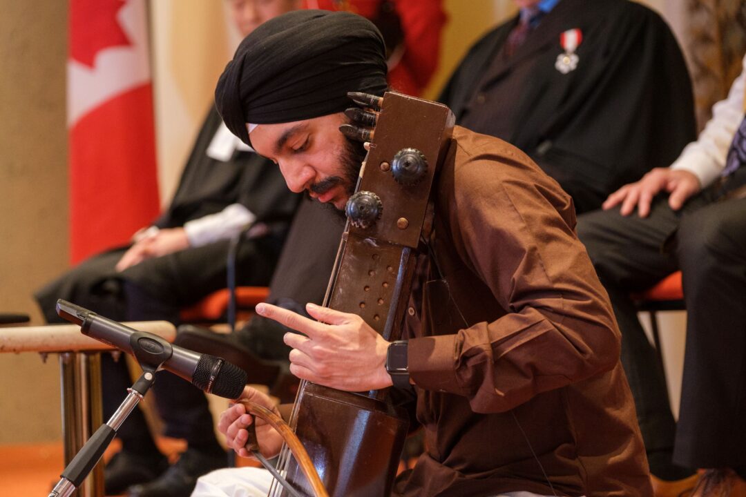 Musician, Arwant Kang performing.