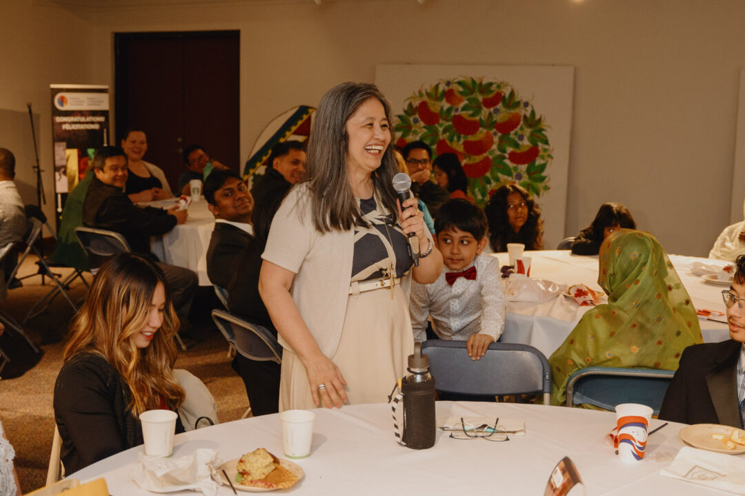 Woman speaking at roundtable discussions.