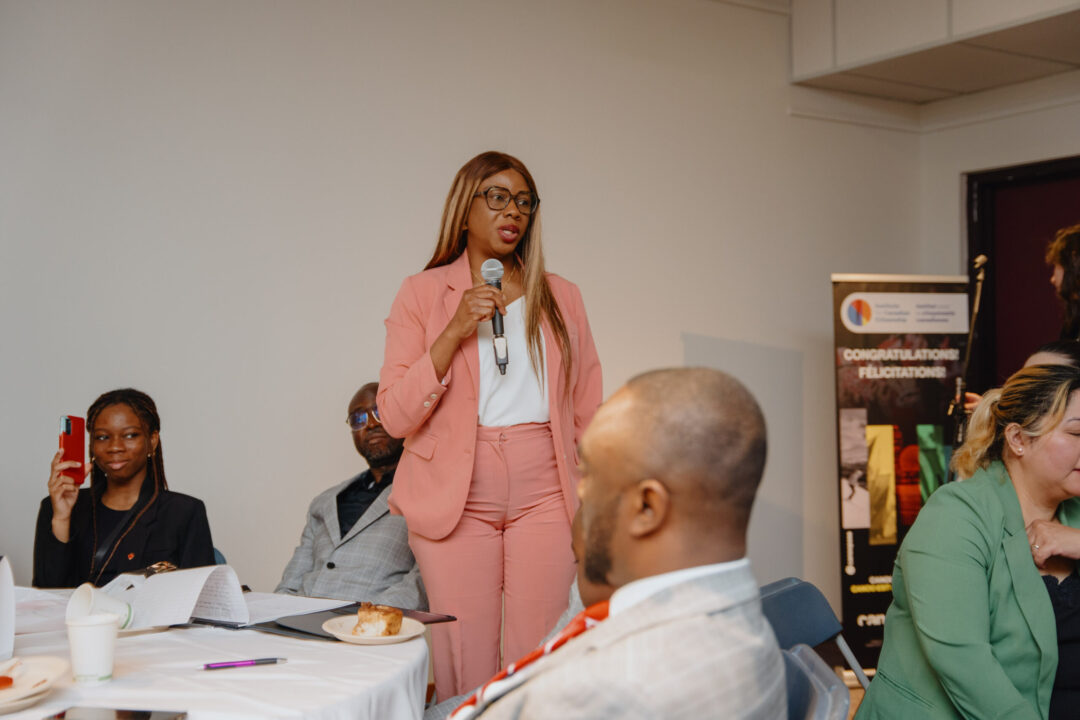 Woman speaking at roundtable discussions.