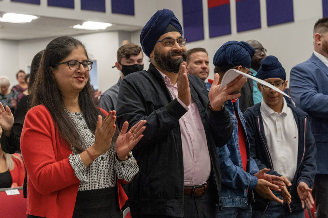 New citizens celebrating at a citizenship ceremony.