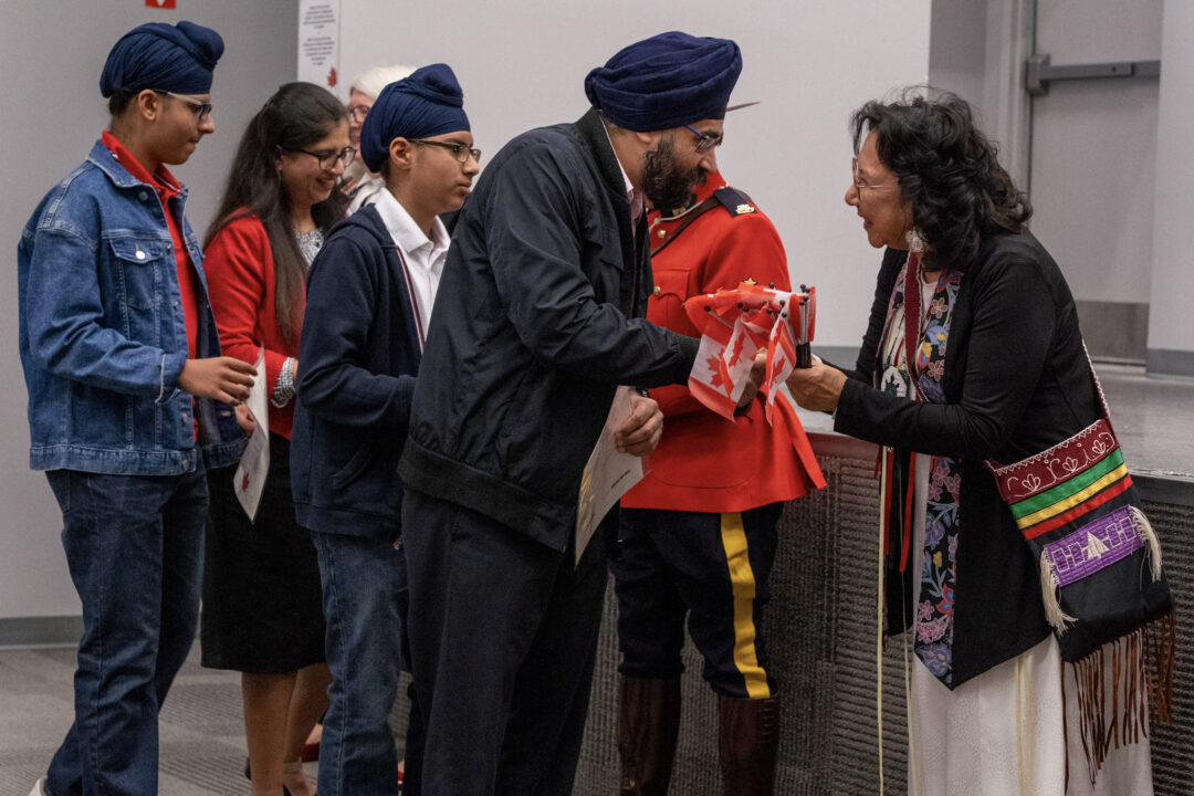 New citizens celebrating at a citizenship ceremony.
