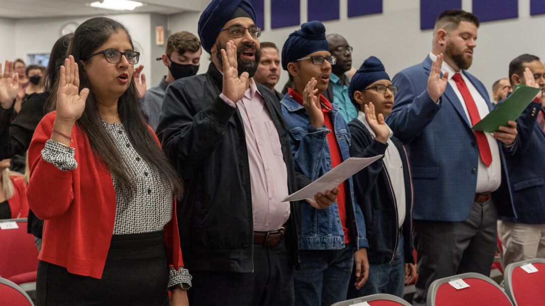New citizens taking the oath of citizenship.